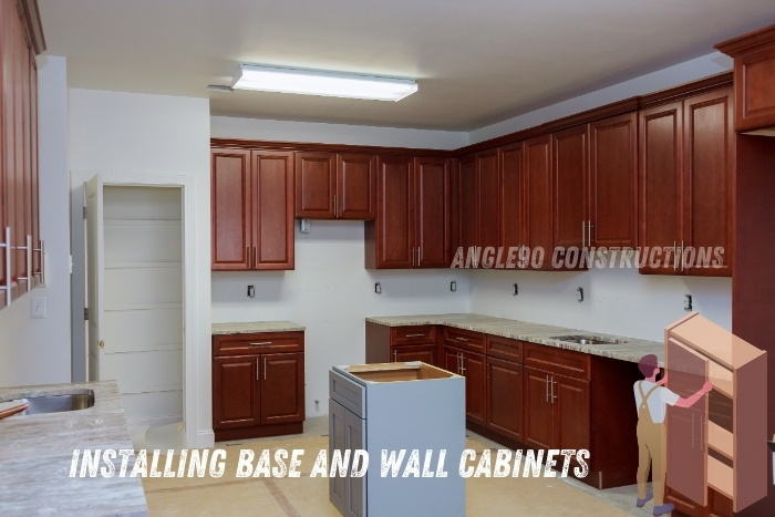 Installation of custom base and wall cabinets in a new kitchen project by Angle90 Constructions, highlighting expert craftsmanship and high-quality materials in Coimbatore. Enhance your kitchen's functionality and aesthetics with our professional cabinet installation services