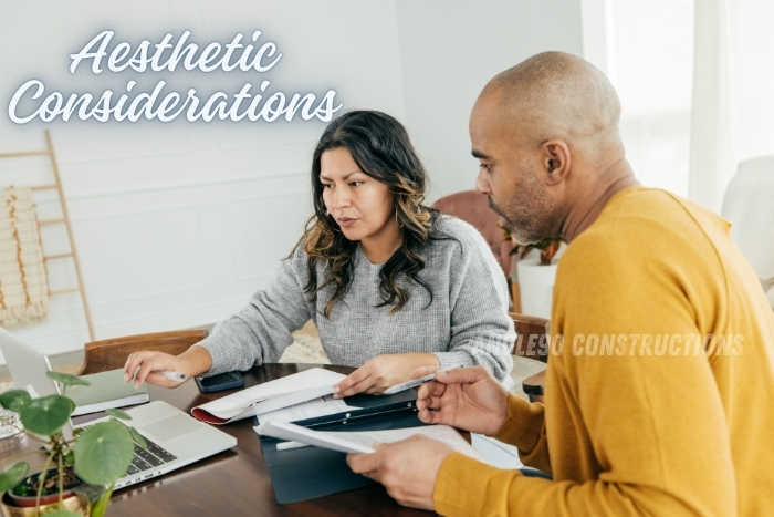 Couple discussing aesthetic considerations for a commercial space design. Angle90 Constructions in Coimbatore provides expert guidance in blending functionality with visual appeal, ensuring a harmonious and inspiring environment