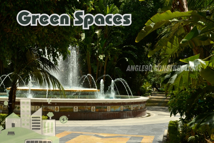 Beautifully landscaped green spaces in Coimbatore designed by Angle90 Constructions, featuring a central fountain surrounded by lush tropical plants. Our landscape architecture services create tranquil environments that enhance urban living