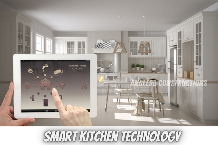 Innovative smart kitchen design with remote control capabilities, created by Angle90 Constructions in Coimbatore, blending technology with modern kitchen aesthetics