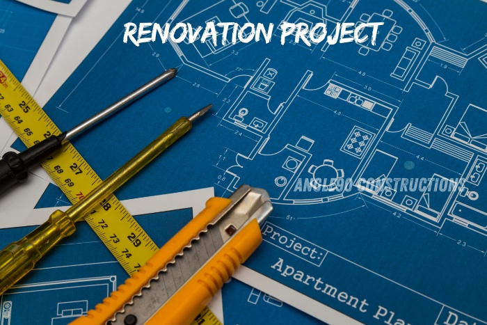 Detailed renovation project blueprint with tools, showcasing professional remodeling services by Angle90 Constructions in Coimbatore