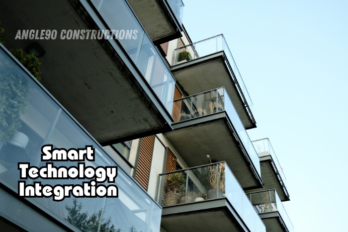 Modern residential building with glass balconies showcasing smart technology integration by Angle90 Constructions in Coimbatore