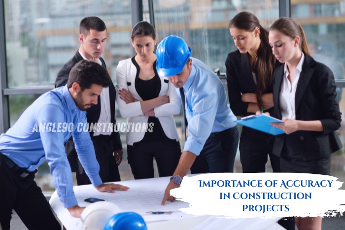 Angle90 Constructions team in Coimbatore discussing blueprints to emphasize the importance of accuracy in construction project