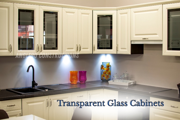 Elegant modular kitchen in Coimbatore with transparent glass cabinets designed by Angle90 Constructions