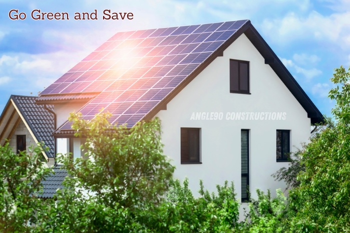 “Modern house with rooftop solar panels surrounded by greenery, promoted by Angle90 Constructions in Coimbatore to encourage eco-friendly and energy-saving homes.