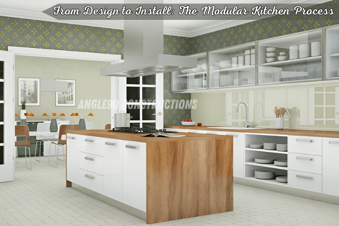 Modern modular kitchen design with wooden island and white cabinets, created by Angle90 Constructions in Coimbatore