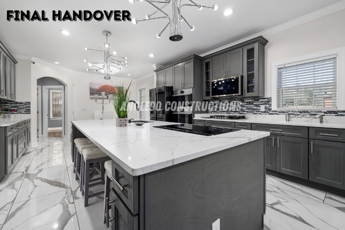 Modern modular kitchen with marble island and elegant finishes, completed and handed over by Angle90 Constructions in Coimbatore